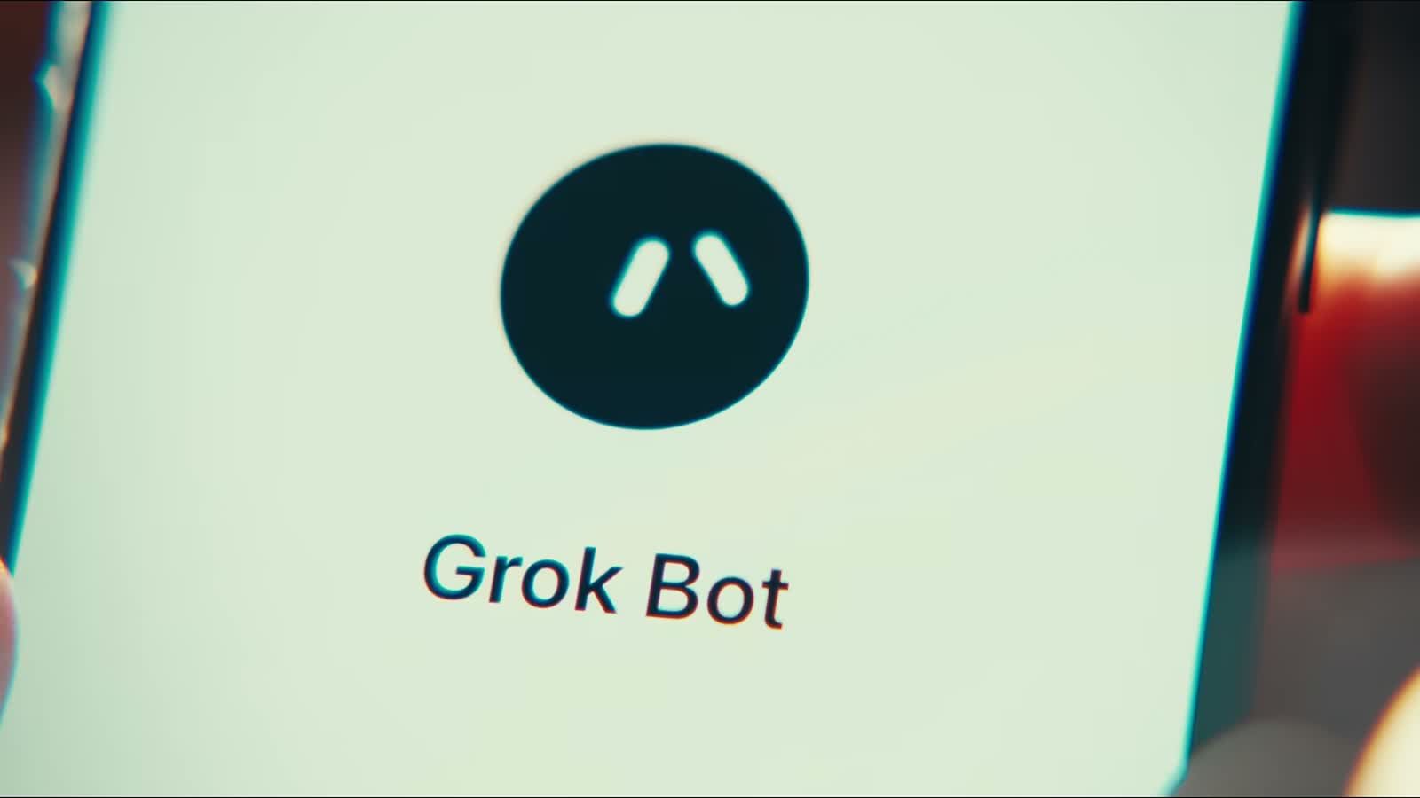 官方影片畫面：手機螢幕上是 Grok Bot 的標誌
